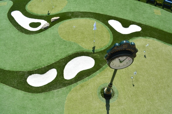 Asheville Synthetic grass golf course with sand traps and golfers